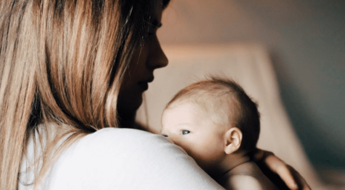 A mother holding her newborn baby