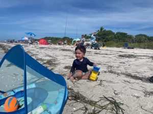 A little boy playing in the sand
