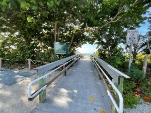 A shaded walkway leading to the beach on Sanibel Island
