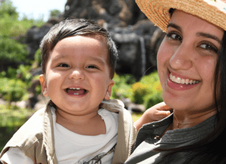 Daniella holding her 1-year old son