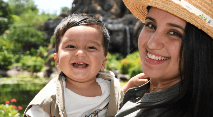 Arriving at Motherhood: A Story of Faith and Fertility Daniella holding her 1-year old son