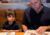 Kids Eat Free (or Cheap) Miami Restaurant Guide Ana-Sofia's husband and son looking at menus at Miller's Ale House