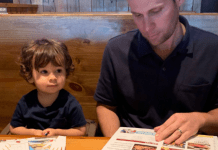 Kids Eat Free (or Cheap) Miami Restaurant Guide Ana-Sofia's husband and son looking at menus at Miller's Ale House