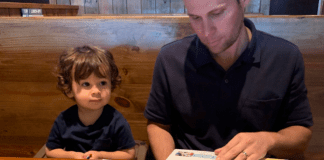 Ana-Sofia's husband and son looking at menus at Miller's Ale House