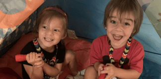 Two kids enjoying summer camp with their grandparents