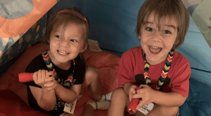 Two kids enjoying summer camp with their grandparents