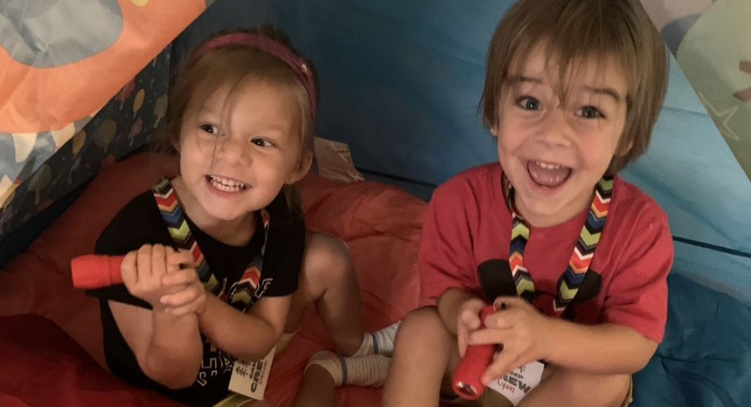 Two kids enjoying summer camp with their grandparents