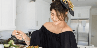 Michele holding a plate of homemade arroz con gandules