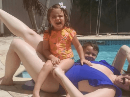 A woman with kids by the pool, embracing her summer beach body