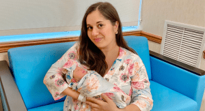 Rachel holding her newborn daughter