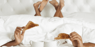 A couple enjoying breakfast in bed