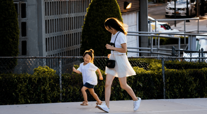 The Marathon of Motherhood A mom running alongside her daughter