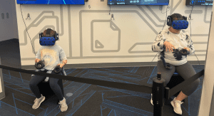 Diana's daughters enjoying the VR cube at the Homestead Cybrarium