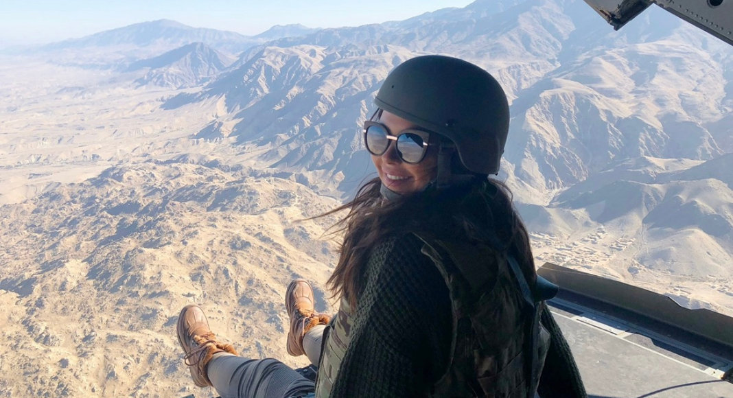 Image: Morgan in a helicopter on a Holiday USO tour to visit our armed forces
