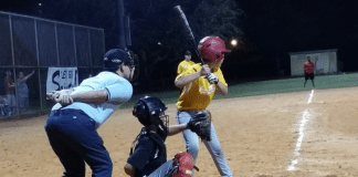 Being a Sports Mom Little league baseball players standing behind home plate