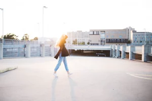 A woman walking across a street