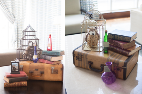 A couple fun themed centerpieces, including potion bottles and stuffed owls