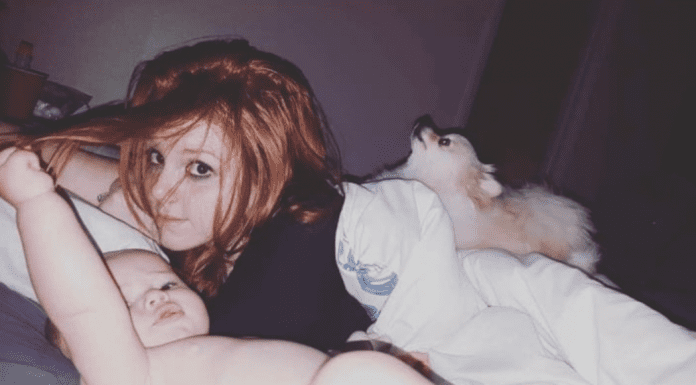 Mom sleeping with her baby and dog