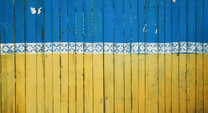 A fence painted like the Ukrainian flag in Kyiv, Ukraine
