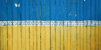 A fence painted like the Ukrainian flag in Kyiv, Ukraine