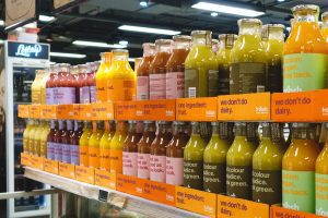 Image: Bottled fruit and veggie beverages on a grocery store shelf
