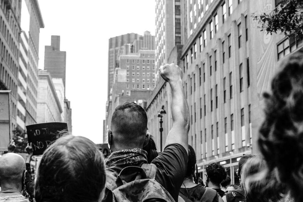 Image: A group of marchers participating in a protest