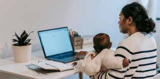 5 Tips for the Momtrepreneur Image: A mom holding her baby while she works at her computer (5 Tips for the Momtrepreneur Minnie Roca Contributor Miami Mom Collective)