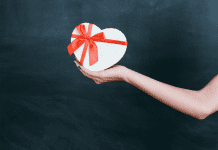 Image: An outstretched arm holding a gift box