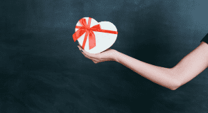 Image: An outstretched arm holding a gift box