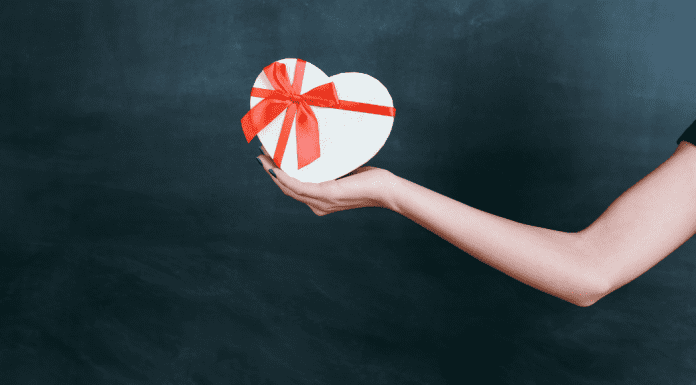 Image: An outstretched arm holding a gift box