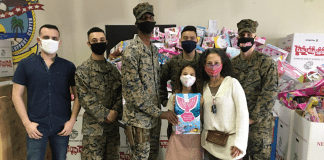 Toys for Tots: Making a Difference for America’s Children Image: Adita and her daughter with several US Marines standing in front of Toys for Tots collection boxes (Toys for Tots: Making a Difference for America's Children Adita Lang Contributor Miami Mom Collective)
