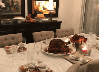 Hosting Friendsgiving: 3 Tips To Make It Enjoyable for Everyone Image: A dining room table set for a Friendsgiving meal