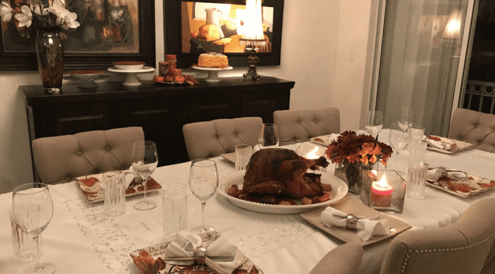 Hosting Friendsgiving: 3 Tips To Make It Enjoyable for Everyone Image: A dining room table set for a Friendsgiving meal