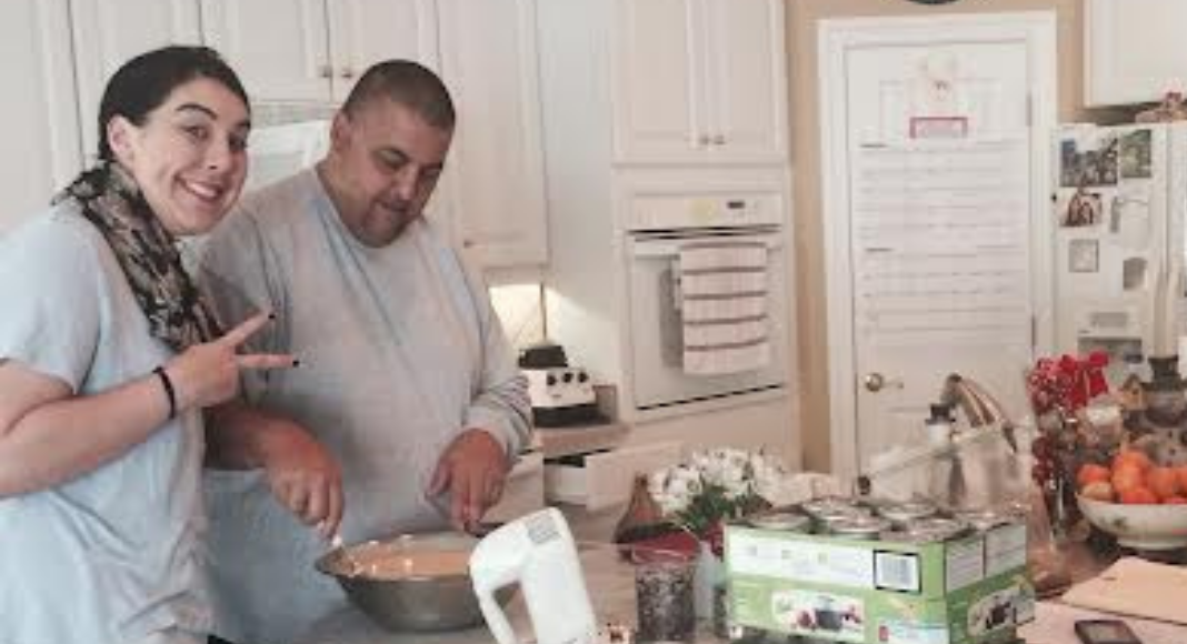 Image: Holly's husband and daughter in the kitchen prepping Thanksgiving dinner together