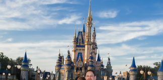 Image: Sandra with her husband and son in front of Cinderella's Castle at Disney (Disney at 50: Walt Disney World's Golden Birthday Celebration Sandra Jacquemin Contributor Miami Mom Collective)