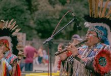 Image: Indigenous people playing traditional instruments