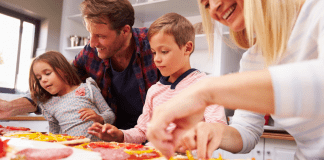 Image: A family making homemade pizza together (Pizza Night: 10 Homemade Pizza Ideas for a Fun Family Friday Night Lorena Lougedo Contributor Miami Mom Collective)