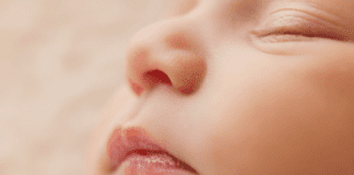 A picture of a sleeping baby's face (Baby Safety Month: Helpful Tips for Keeping Your Little One Safe Dianna Hill Contributor Miami Mom Collective)
