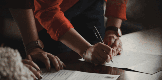 Designation of Health Care Surrogate for A Minor: What You Should Know A couple signing documents (Designation of Health Care Surrogate for A Minor: What You Should Know Kristina Hernandez Tilson Contributor Miami Mom Collective)