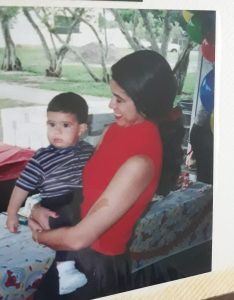 Image: Becky holding her son at his 1st birthday party