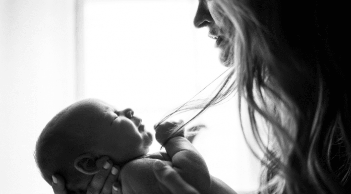 To Parent in a Broken World A mother holding her infant (To Parent in a Broken World Kristin Parke Contributor Miami Mom Collective)