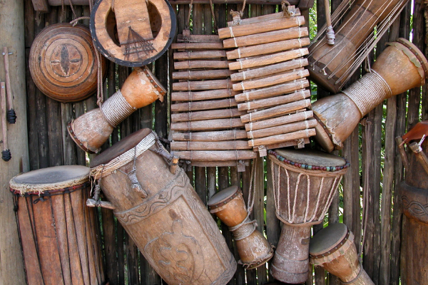 A display of hand carved drums, xylophones, and other instruments (Hispanic Heritage Month: Ways to Celebrate Lorena Lougedo Contributor Miami Mom Collective)