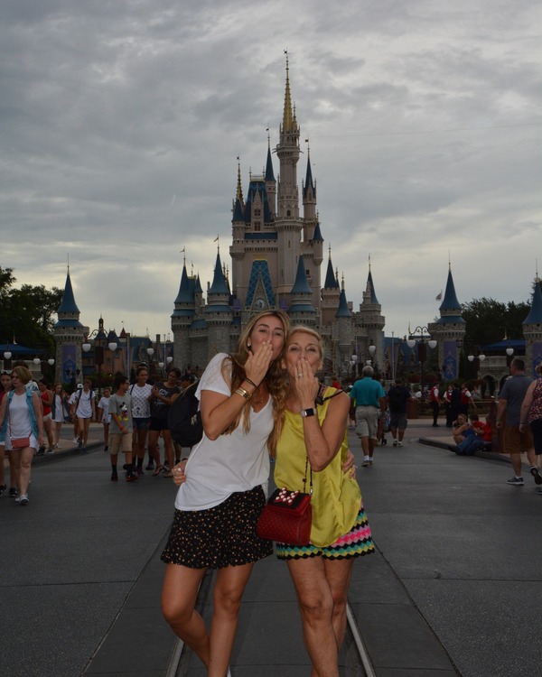 Sandra and her friend in front of Cinderella's castle (Disney Has Some Secrets, Sort Of Sandra Jacquemin Contributor Miami Mom Collective) 