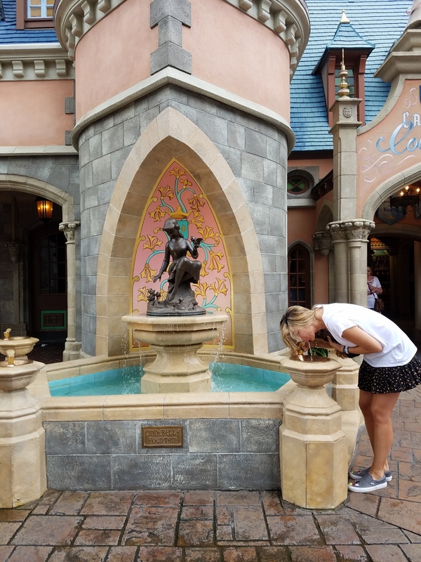 Sandra taking a drink at Cinderella's fountain (Sandra Jacquemin Contributor Miami Mom Collective)