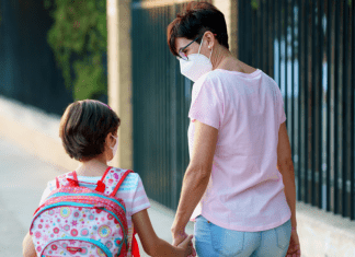 A mother and daughter walking to school (Kids and Tech: Back to School in a Pandemic Be Strong International Miami Mom Collective)