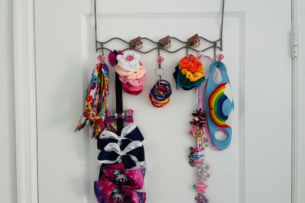 An example of a DIY hair accessory organizer for hair bows, hair ties, scrunchies, and face masks