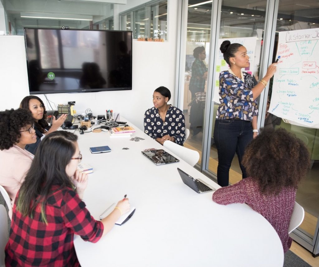 Image: A group of Black and minority women in a business meeting