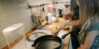 A mom and daughter cooking together in the kitchen (Summer Fun that Leads to Lasting NEW Habits for the Entire Family Adita Lang Contributor Miami Mom Collective)