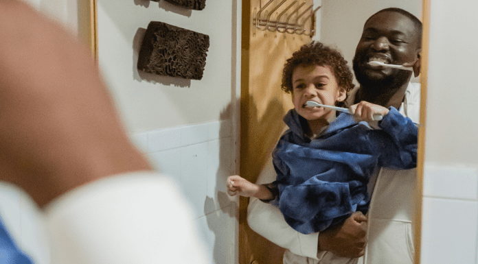 A father and son brushing their teeth (Favorite Things: Dr. Bob's Top 6 Dental Products for Kids Lynda Lantz Contributor Miami Mom Collective)