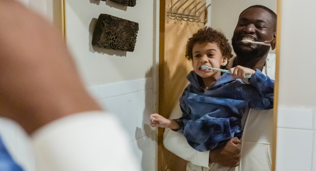 A father and son brushing their teeth (Favorite Things: Dr. Bob's Top 6 Dental Products for Kids Lynda Lantz Contributor Miami Mom Collective)